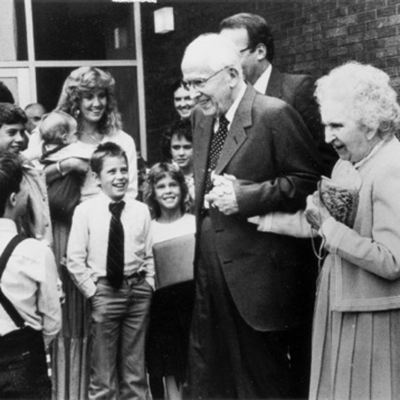 President and Sister Benson greet a group of children circa 1986.